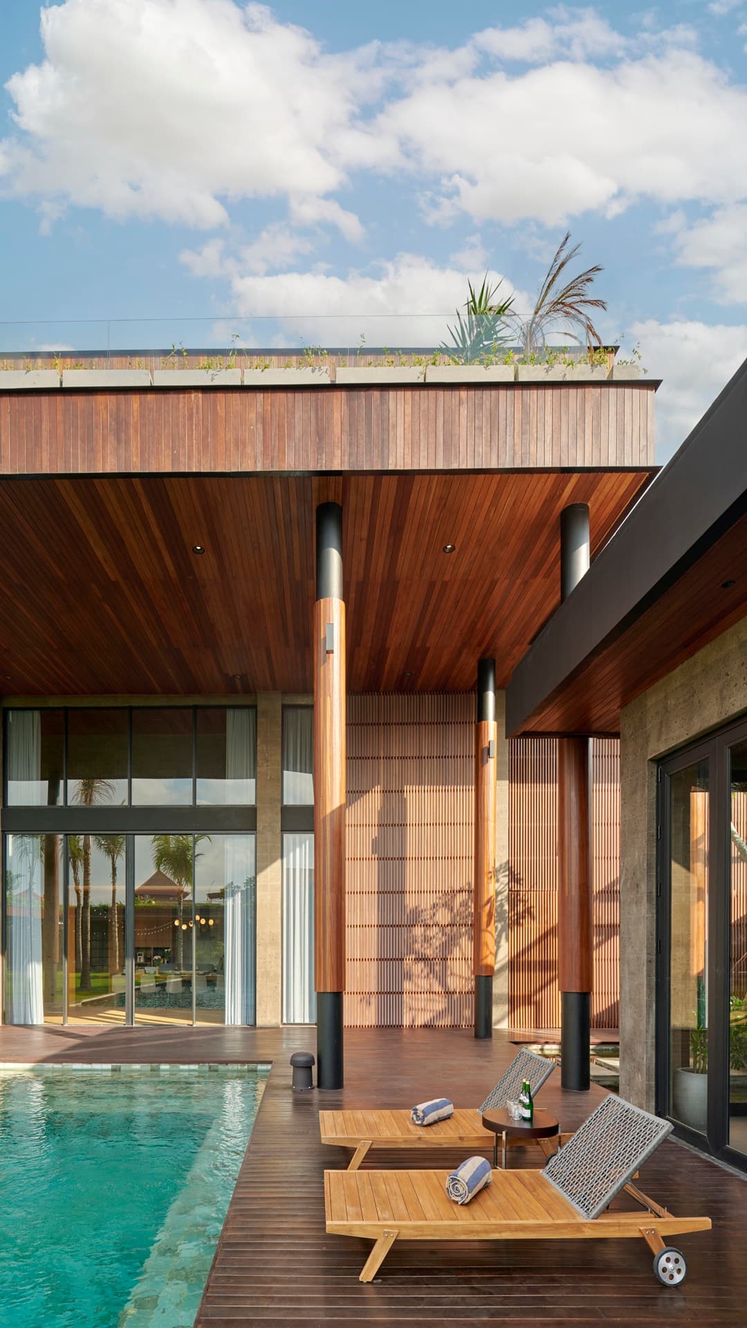 The rooftop-framed pool deck and teak sun loungers